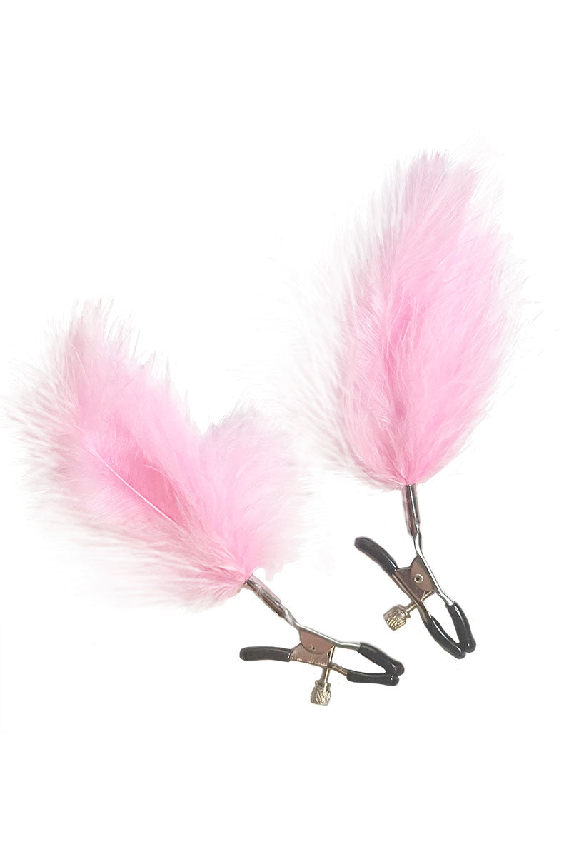 Detail view of pink bullet vibrator with smooth body and single control button.