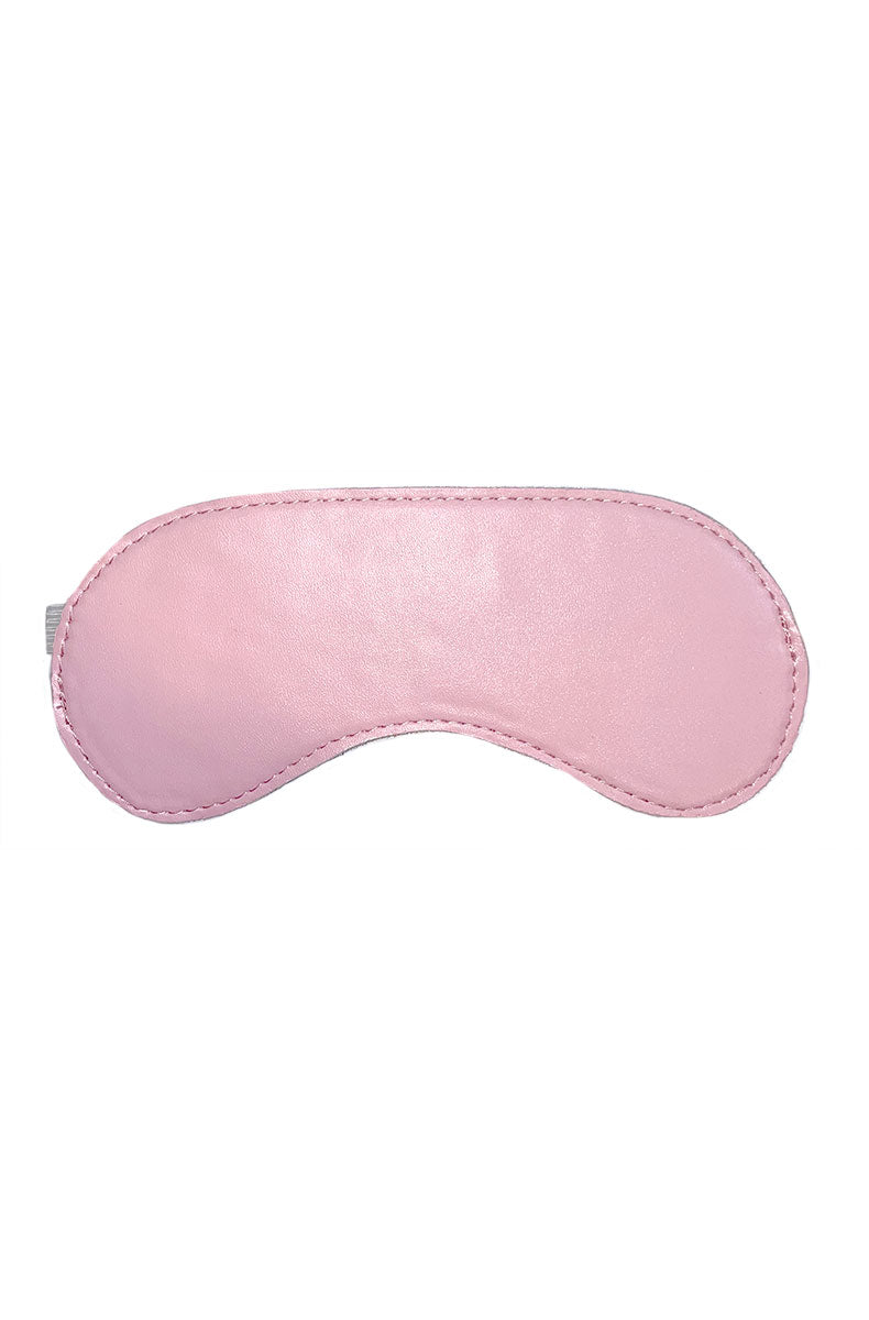 Front view of a pink satin blindfold with a small silver tag on a white background.