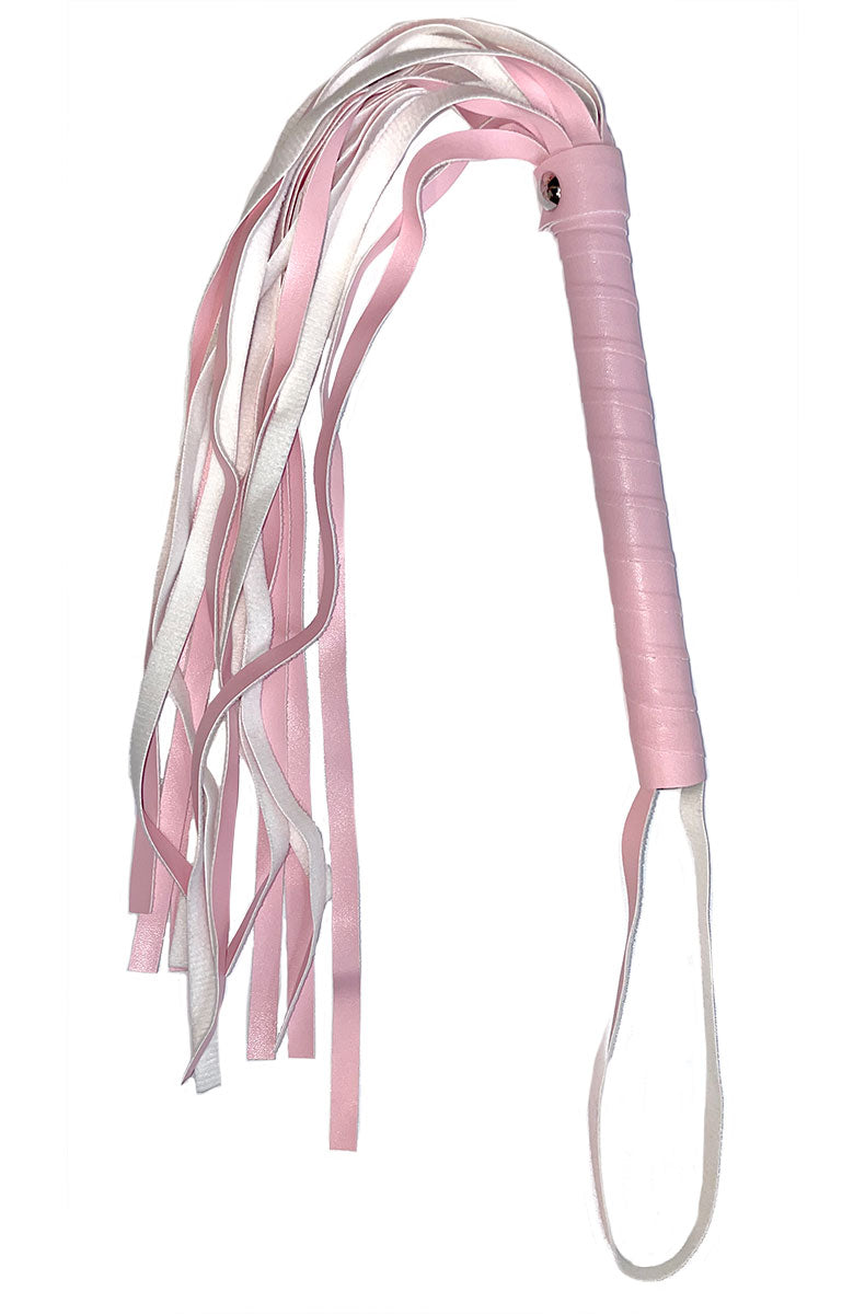 Pink and white satin flogger with multiple ribbon falls and a wrapped pink handle with wrist loop.