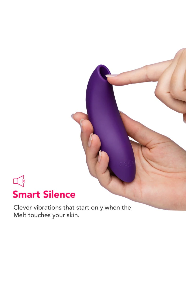 Hands demonstrating Smart Silence feature with purple vibrator and finger touching surface