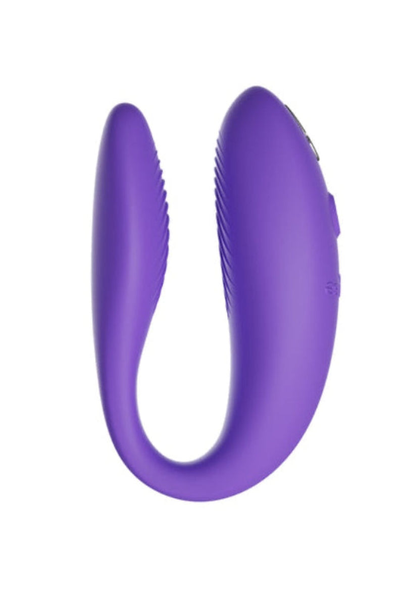 Front view of purple U-shaped couples vibrator with ridged texture on one arm