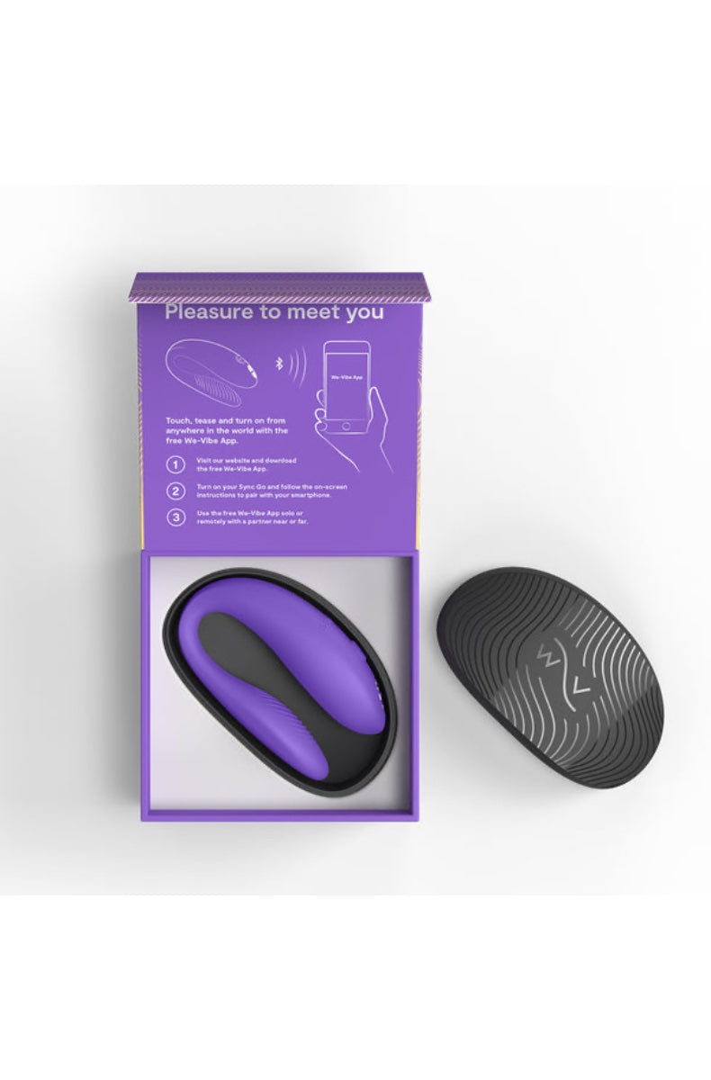 Open purple gift box showing couples vibrator and black textured travel case
