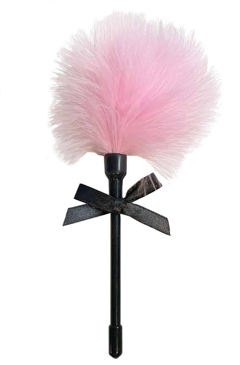 Detail view of pink feather tickler with soft plumes attached to a slim handle.