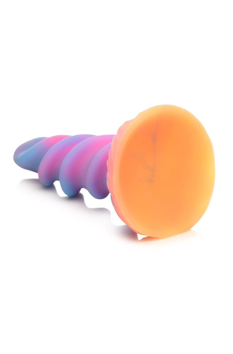 Rear view of unicorn horn glow silicone dildo, twisted shaft and flared base.