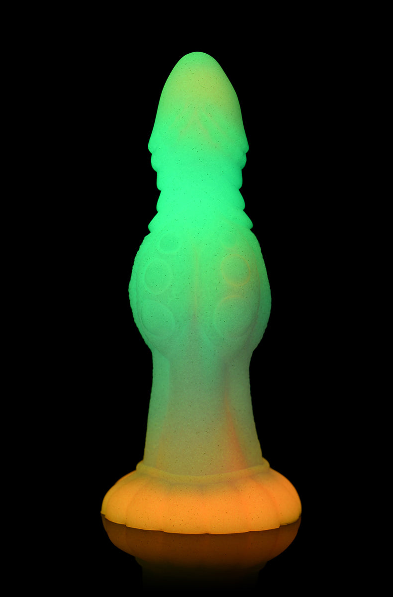 Side view of Galactic Alien glow silicone dildo, ridged head and bumpy mid-shaft.