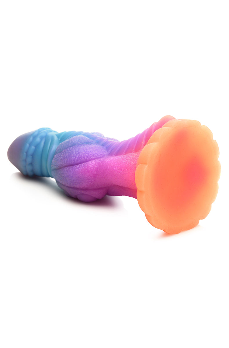 Rear view of Galactic Alien glow silicone dildo, bumpy shaft and flared base.