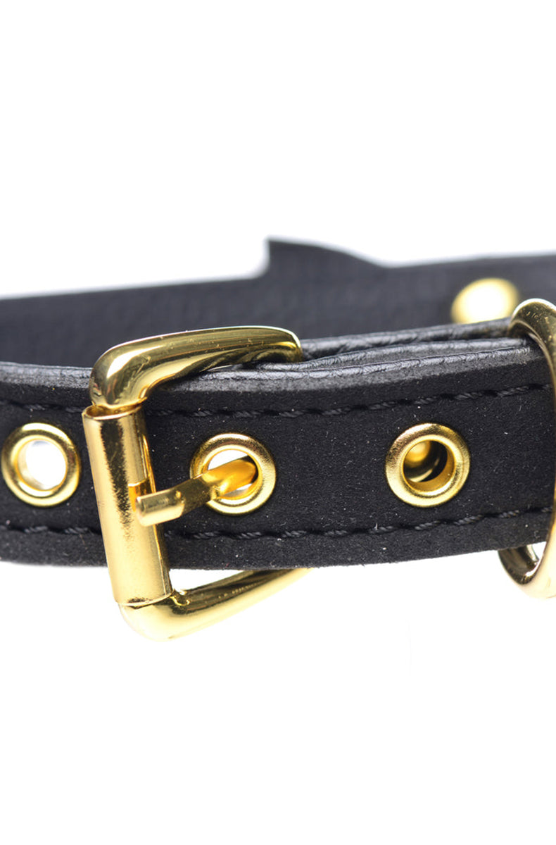 Black suede-finish vegan leather collar with a small black bow at the front and a gold-tone jingle bell hanging below.