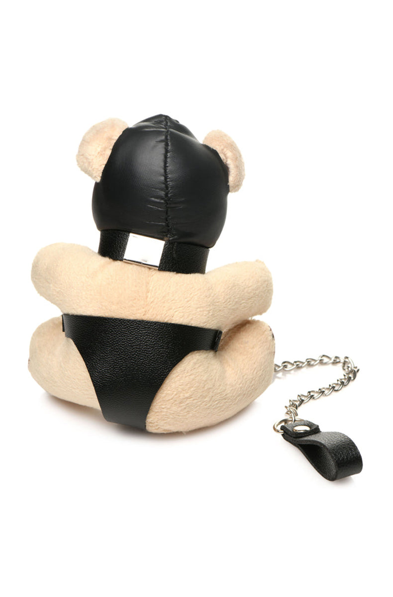 Back view of tan plush teddy bear keychain showing black PU panties and silver key ring on hand loop.