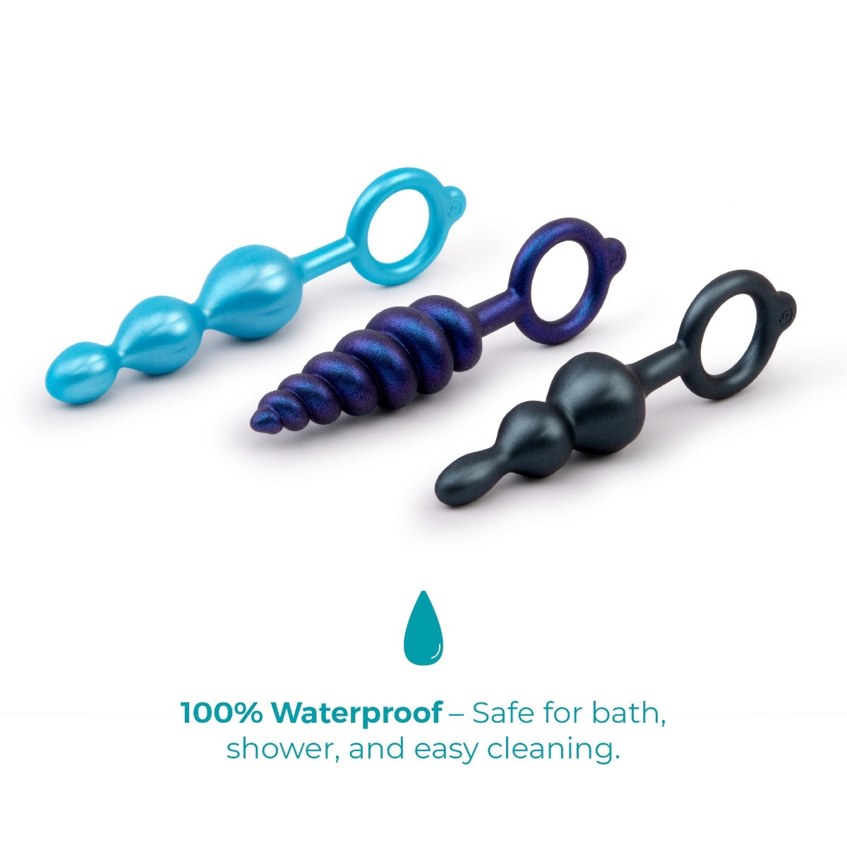 The three anal plugs lying flat: teal and black smooth beads and a blue swirl, each with a finger ring, on white.