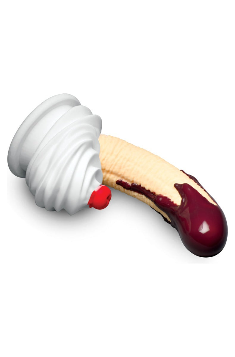 The dildo laid on its side showing the curve of the shaft and the depth of the base