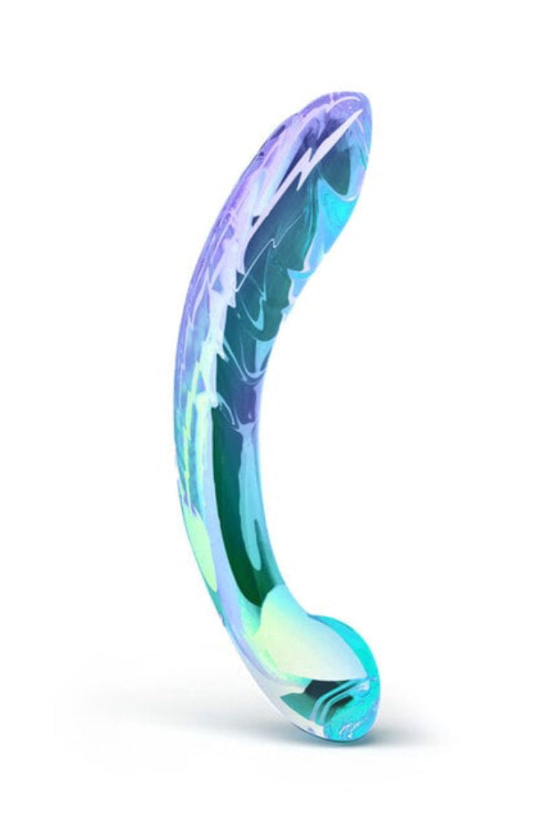 Iridescent blue, green, and purple glass G-spot dildo standing upright, curved ribbed shaft with a rounded bulb, on white.