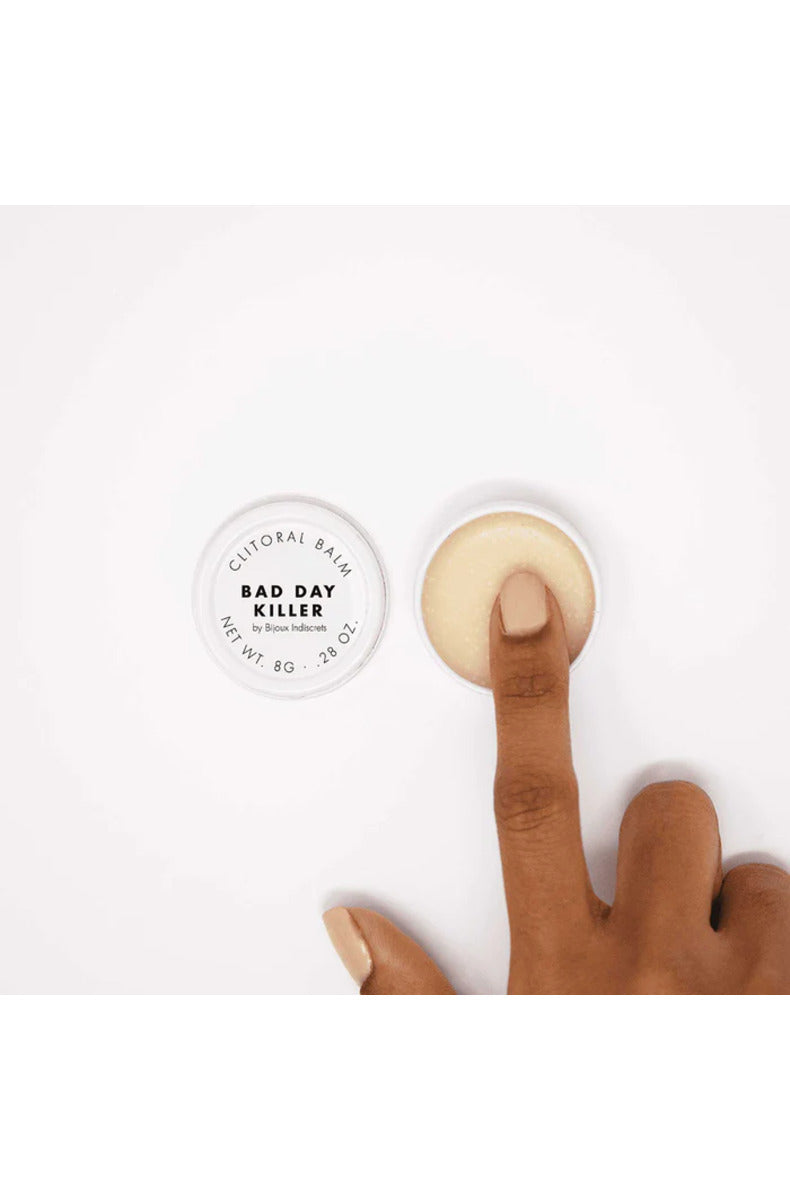 Bijoux Clitherapy Bad Day Killer open balm tin with a finger swiping balm