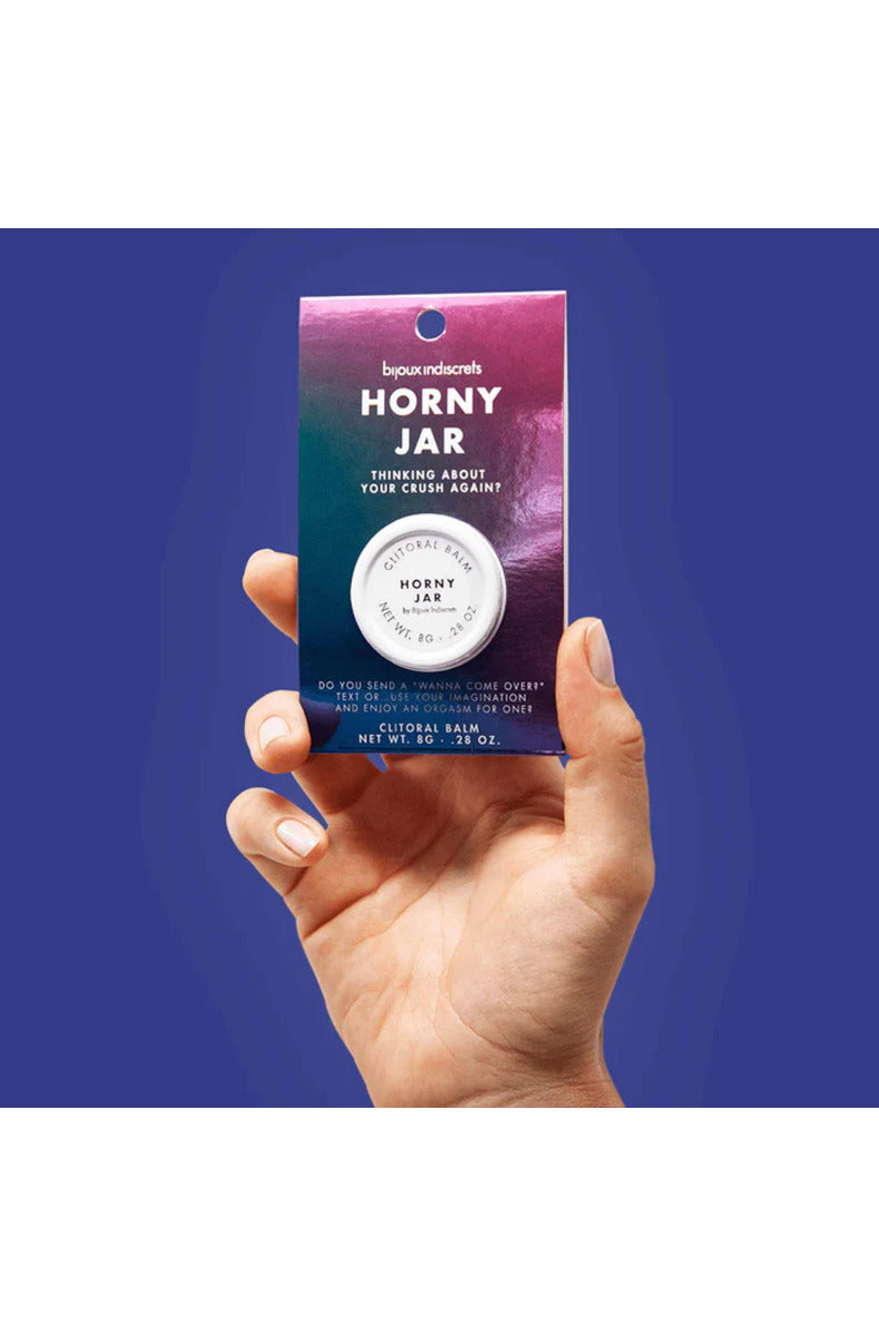 Bijoux Clitherapy Horny Jar clitoral balm package held in hand