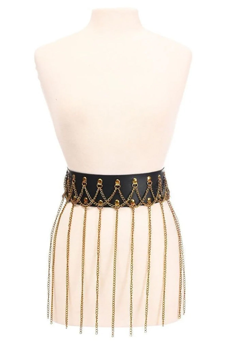 Wide black faux-leather waistband studded with gold-tone hardware loops, with long gold chains hanging as fringe to upper-thigh length.