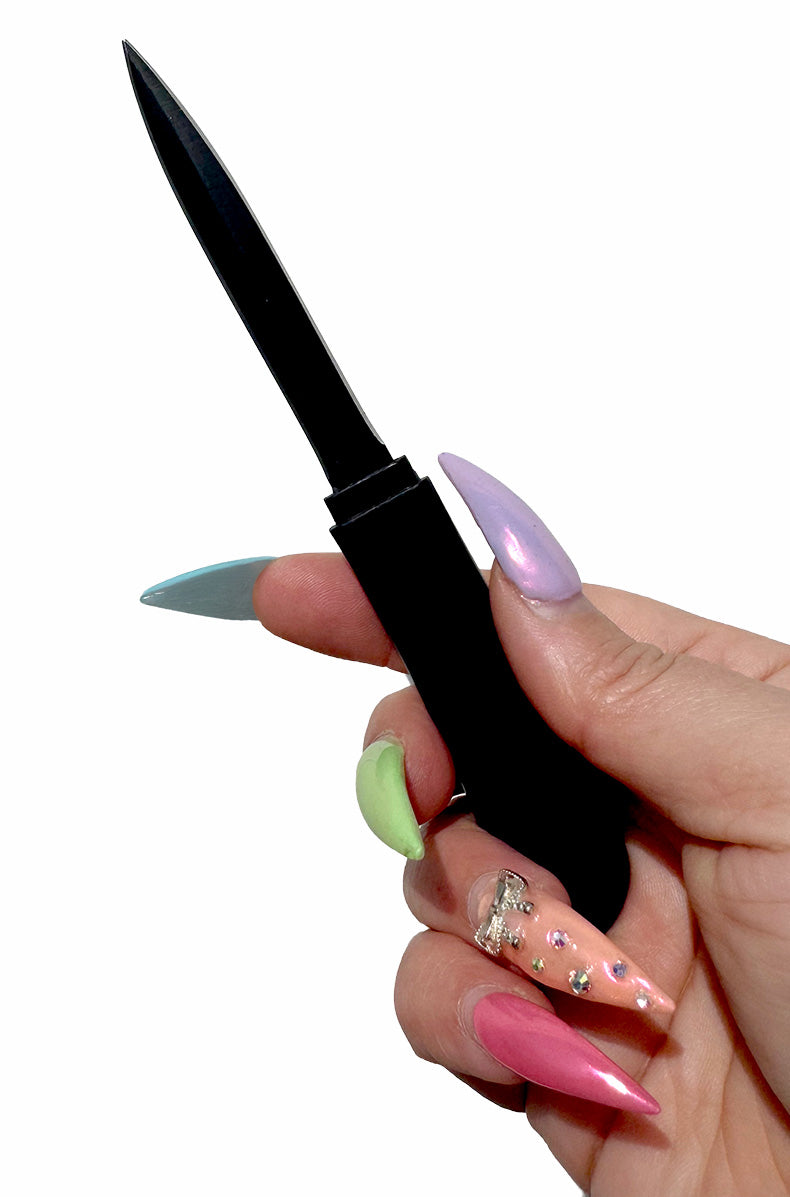 Person using black comb with hidden blade everyday carry 