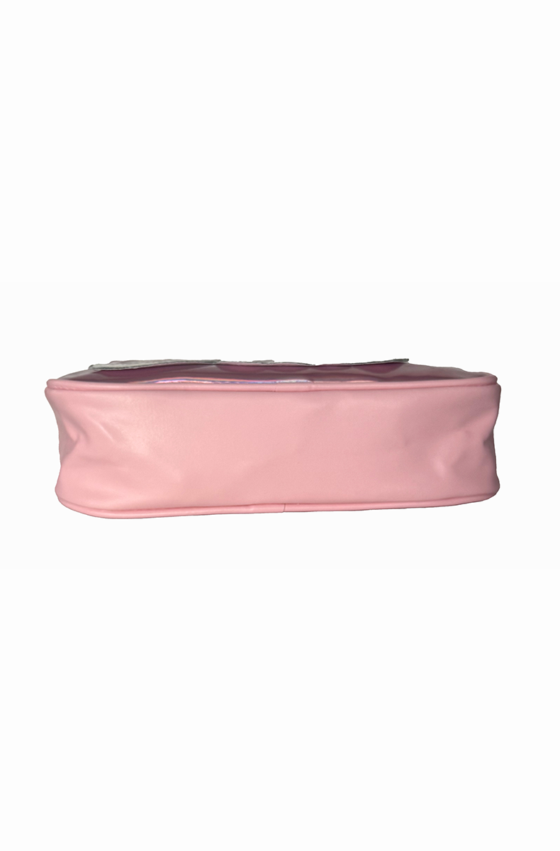 Pink and iridescent silver-pink holographic travel bag with bold "Slut" lettering in script, outlined and trimmed in clear glitter, with a top metal zipper.