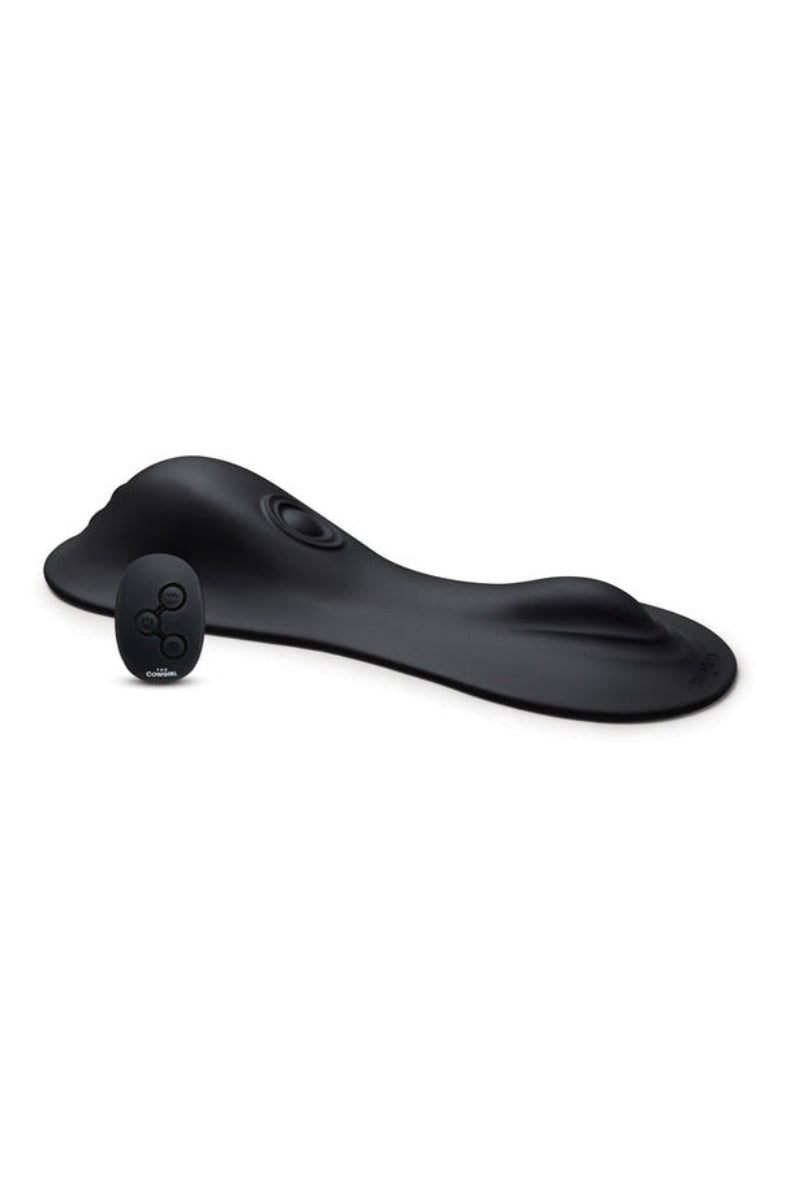 The Cowgirl Rodeo Rumbler black grinding pad with its remote control