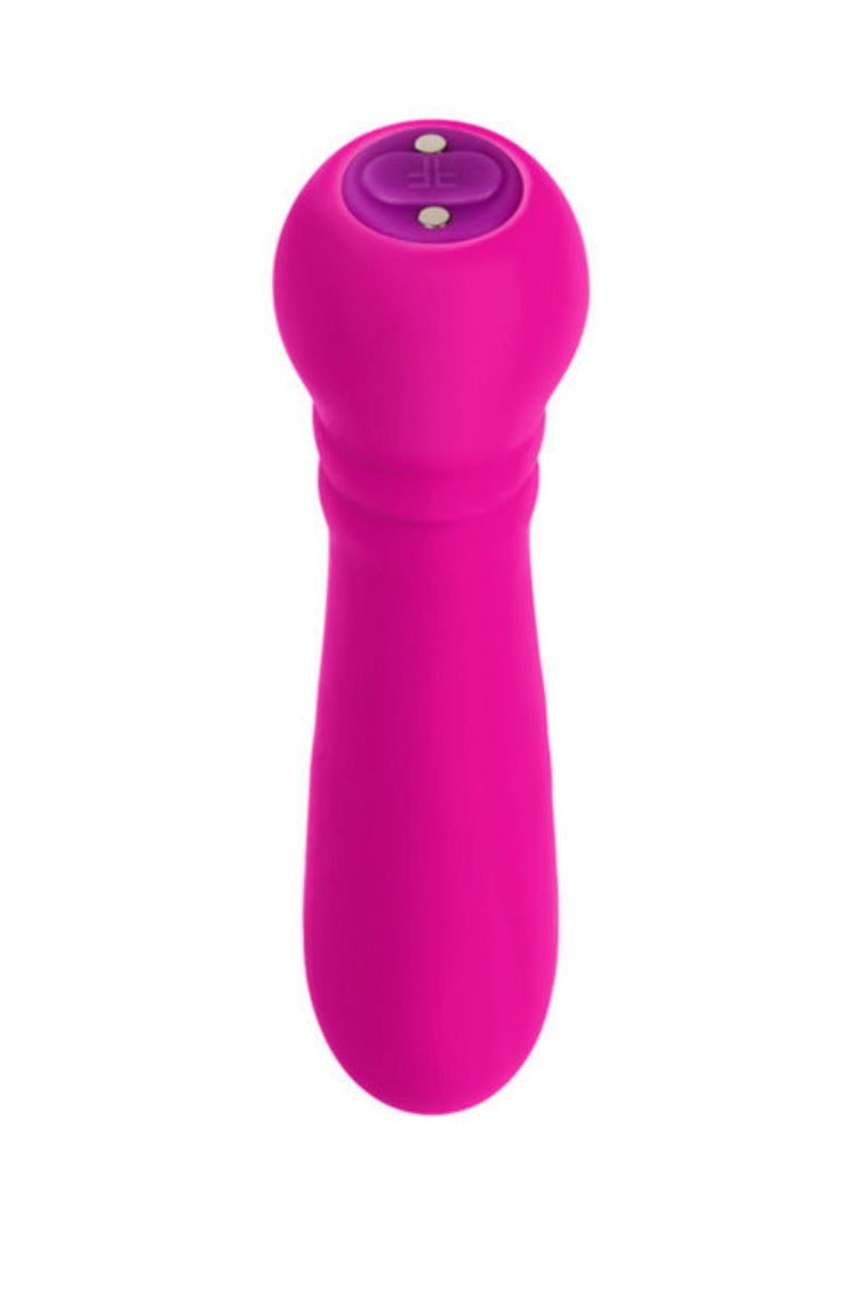 Hot pink silicone bullet vibrator seen from above showing the FemmeFunn button cap, on white.