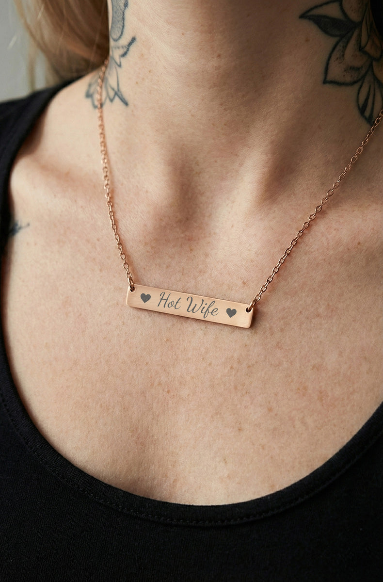 Rose gold Hot Wife bar necklace worn on model's chest