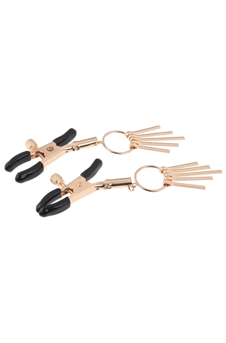 Close-up of slim rose-gold tweezer clamp jaws with black rubber tips and adjustable slider.