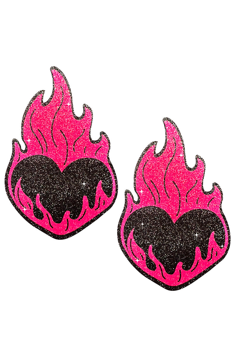 Two heart-and-flame-shaped pasties: a black glitter heart at the center surrounded by neon pink glitter flames.