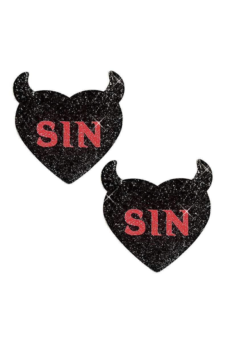 Two black-glitter devil-heart-shaped pasties with two pointed horns and "SIN" printed across the front in red glitter block letters.