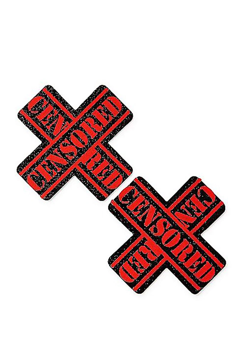Two black glitter X-shaped pasties stamped with "CENSORED" in bold red lettering across each axis.