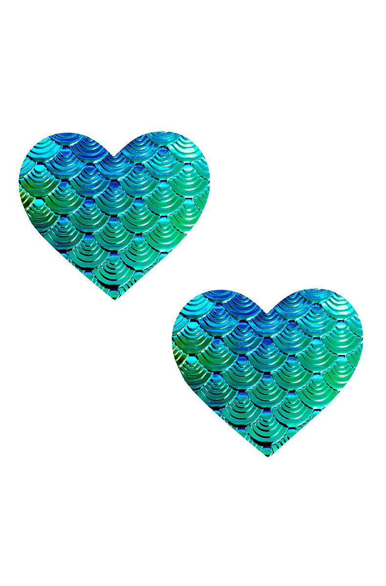 Two heart-shaped pasties with a 3D embossed mermaid-scale texture in iridescent teal that shifts blue and green.