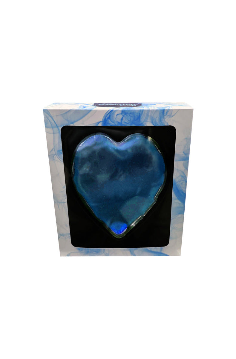 Blue heart-shaped gel warming massager with a metal click disk in a white window box with blue smoke graphics.