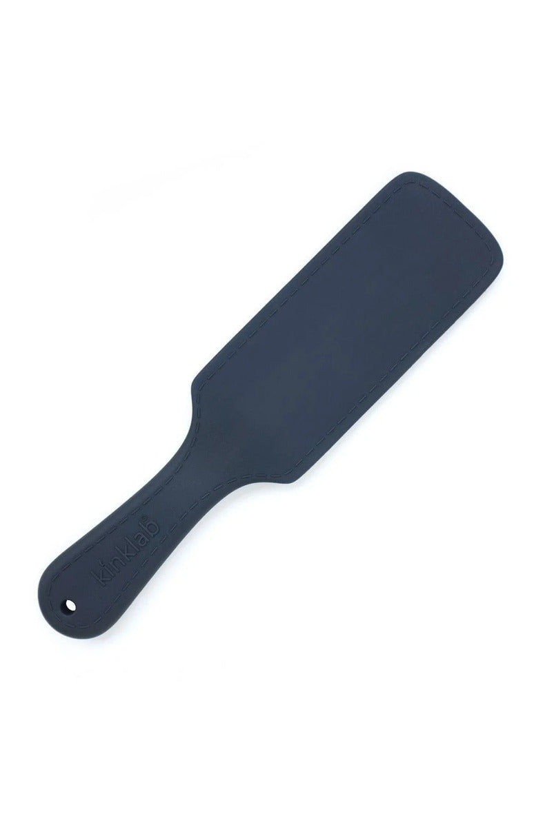 Black KinkLab ThunderClap conductive silicone spanking paddle with a stitched edge and wrist strap.