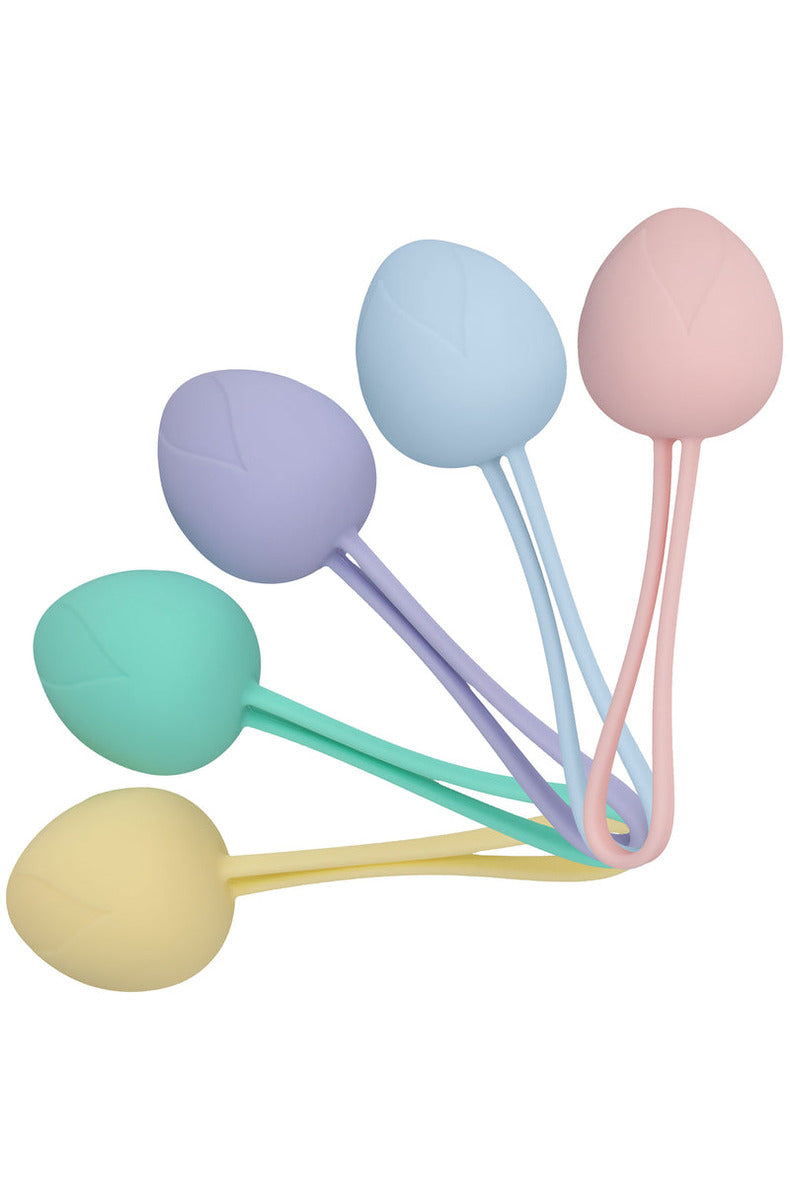 Five pastel berry-shaped silicone kegel balls with silicone pull loops, fanned out together.
