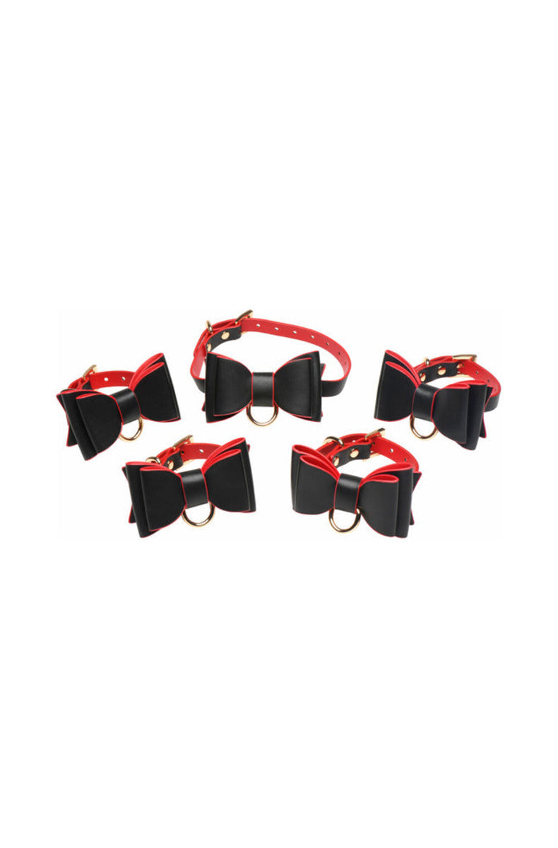 Black and red bow collar with four matching bow cuffs arranged on a white background.