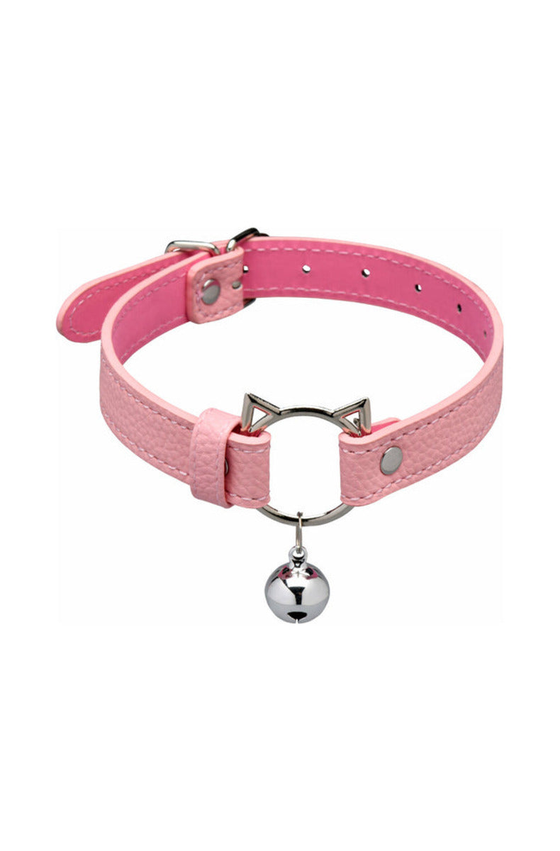 Pink kitty bondage set arranged: belled collar, cuffs, chain leash, connectors, and a kitty-head paddle, on white.