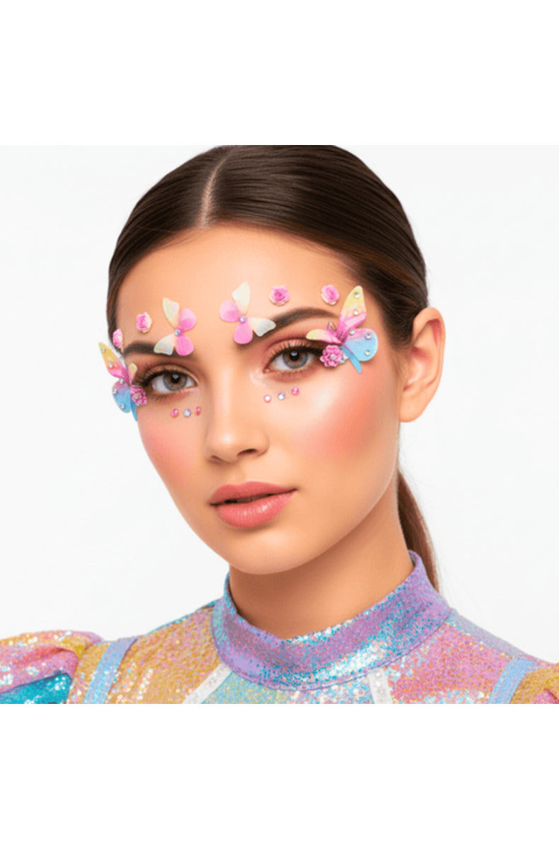 Close-up of a model wearing the pastel butterfly and rose face jewels with rhinestone dots around the eyes.