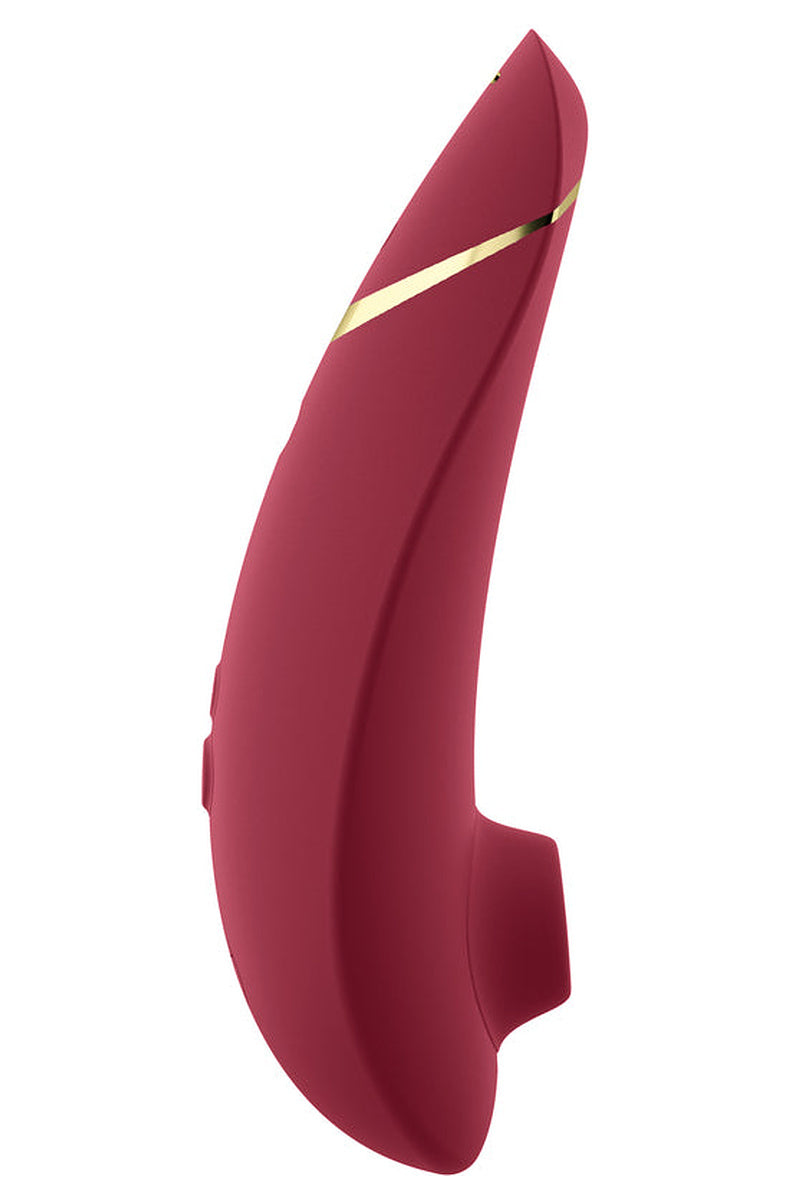 Side view of the Bordeaux Womanizer Premium 2 with its gold accent stripe and silicone head.