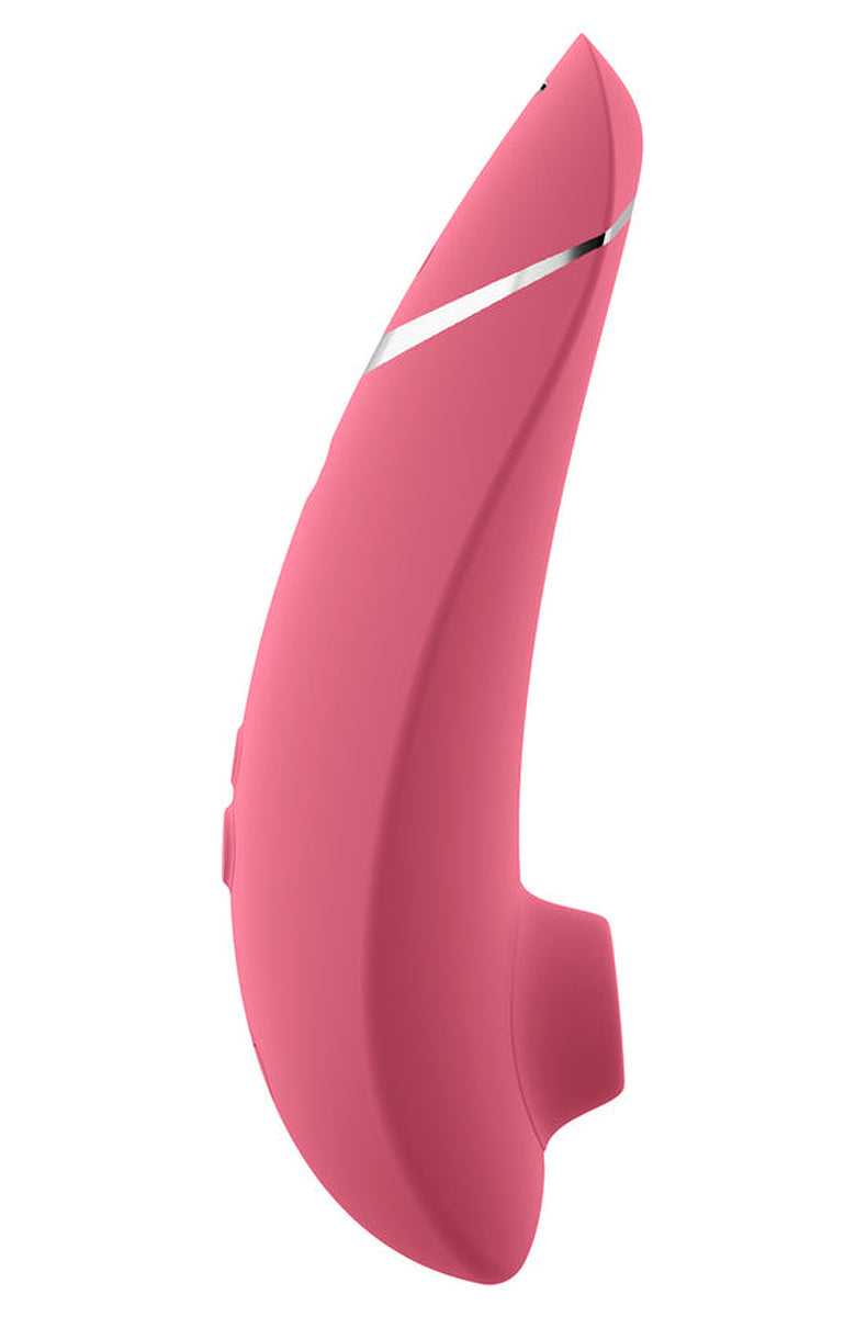 Side view of the Raspberry Womanizer Premium 2 with its silver accent stripe and silicone head.