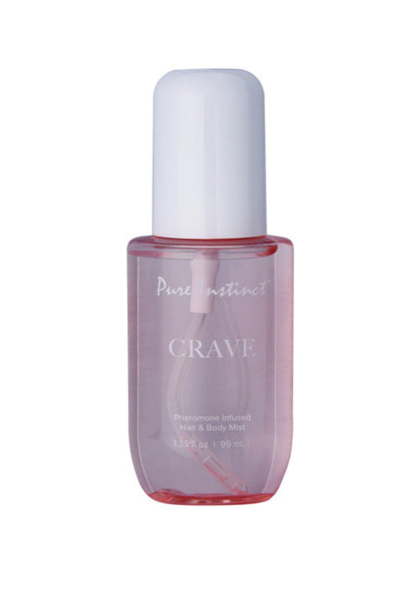 Pink tinted Pure Instinct Crave pheromone hair and body mist bottle, 3.35 fl oz, with a white domed cap.