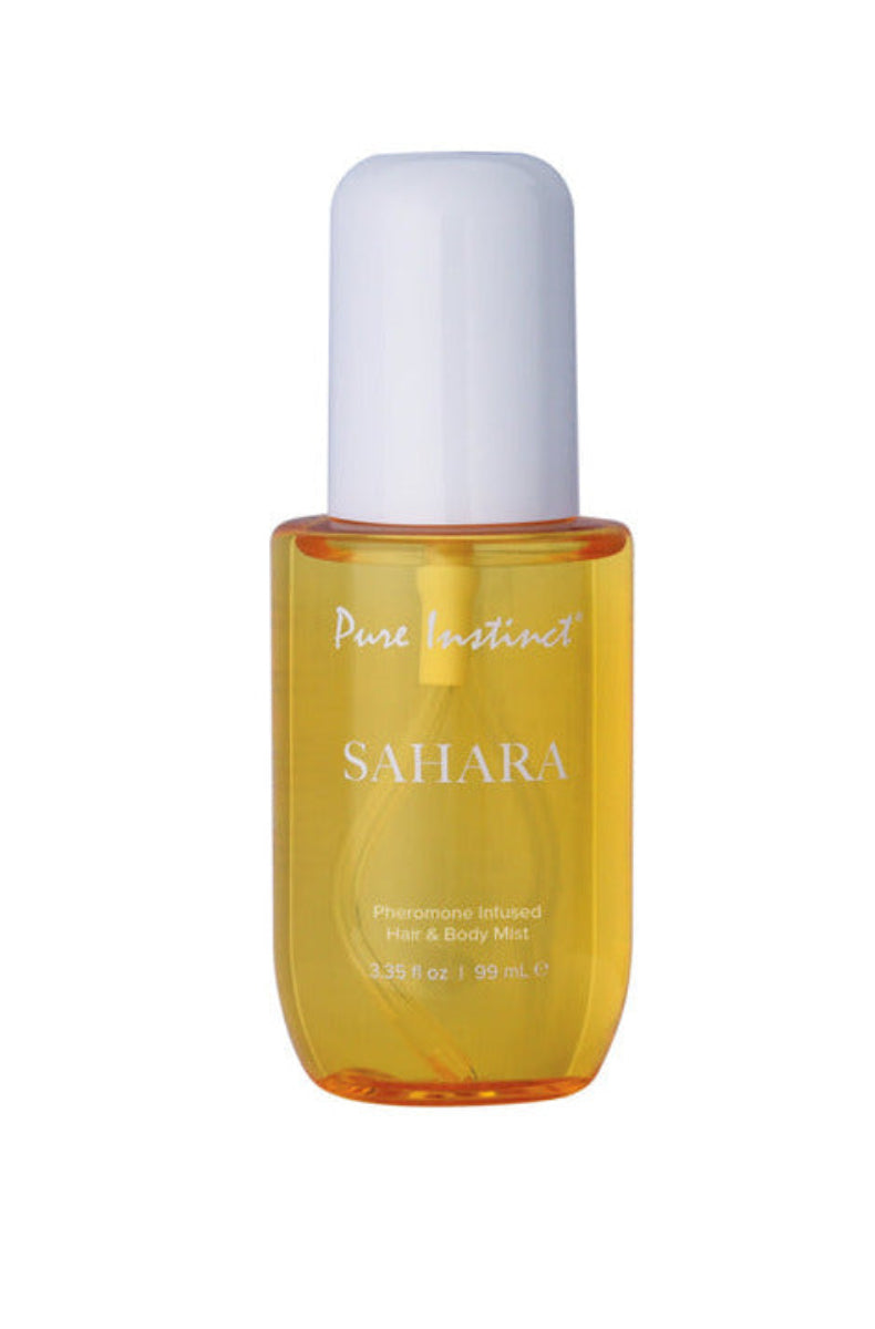 Yellow tinted Pure Instinct Sahara pheromone hair and body mist bottle, 3.35 fl oz, with a white domed cap.