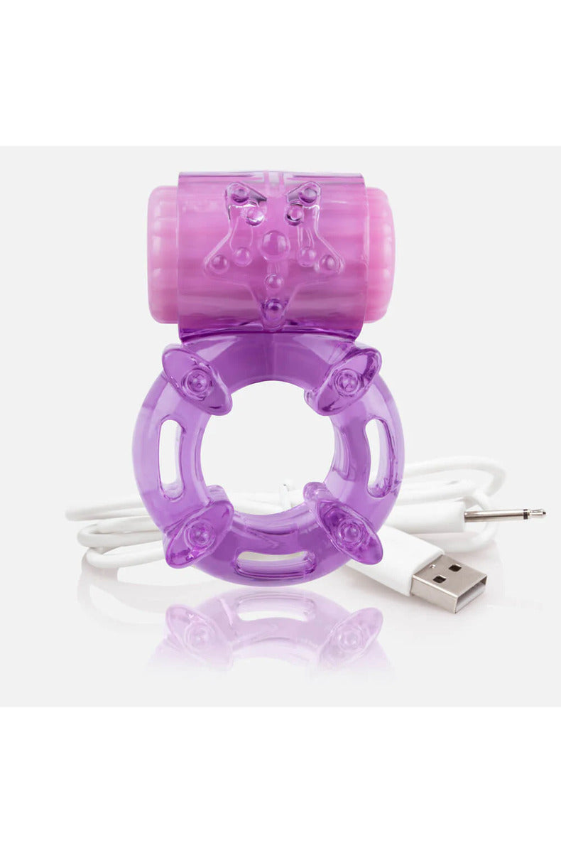 Purple rechargeable vibrating cock ring with a textured motor and stretchy band, on white.