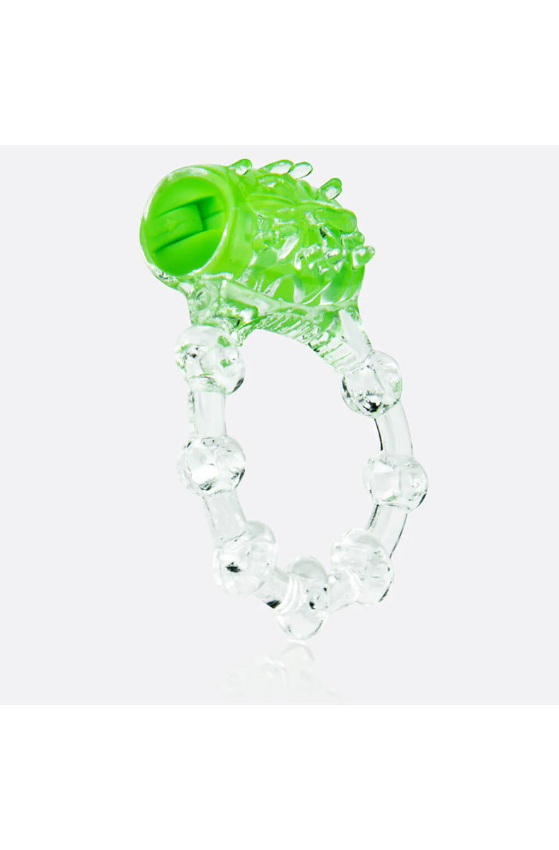 Clear stretchy vibrating cock ring with a green motor, soft ticklers, and a beaded band, on white.