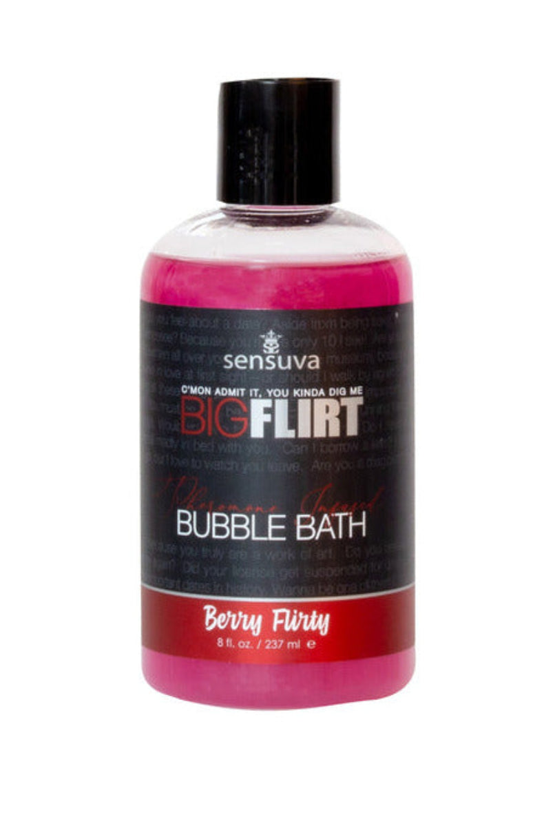Sensuva Big Flirt pheromone bubble bath in Berry Flirty, hot pink liquid in a clear 8 oz bottle with a pickup-line label.