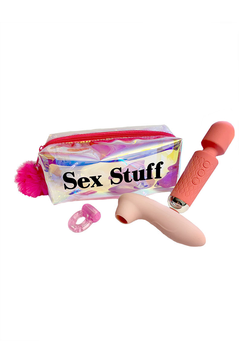Iridescent pouch labeled Sex Stuff beside a pink rechargeable silicone wand, pink suction toy, and pink vibrating cock ring.