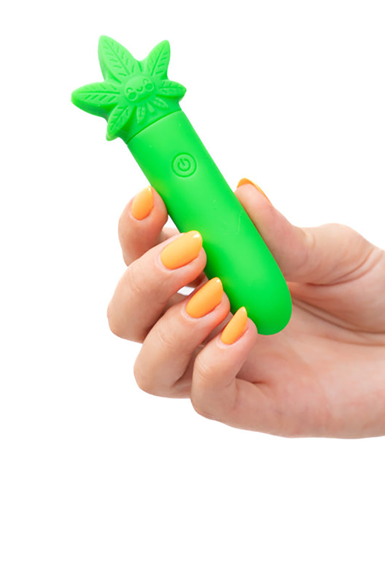 Stoni bullet vibrator held in hand for scale, matte green silicone body.