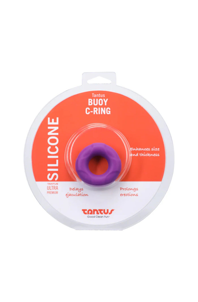 Lilac purple Tantus Buoy thick silicone cock ring in its round Tantus package, on a white background.