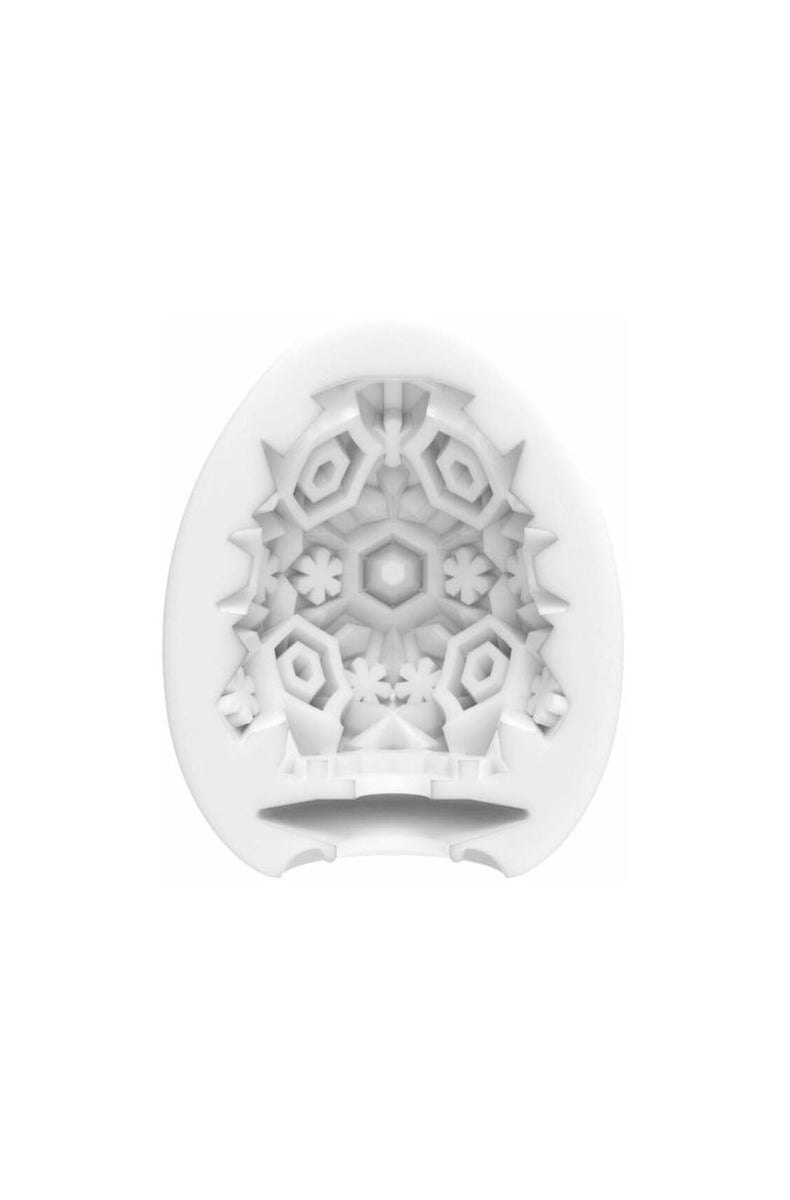 Close-up of a Tenga Egg interior showing the raised snowflake-style texture