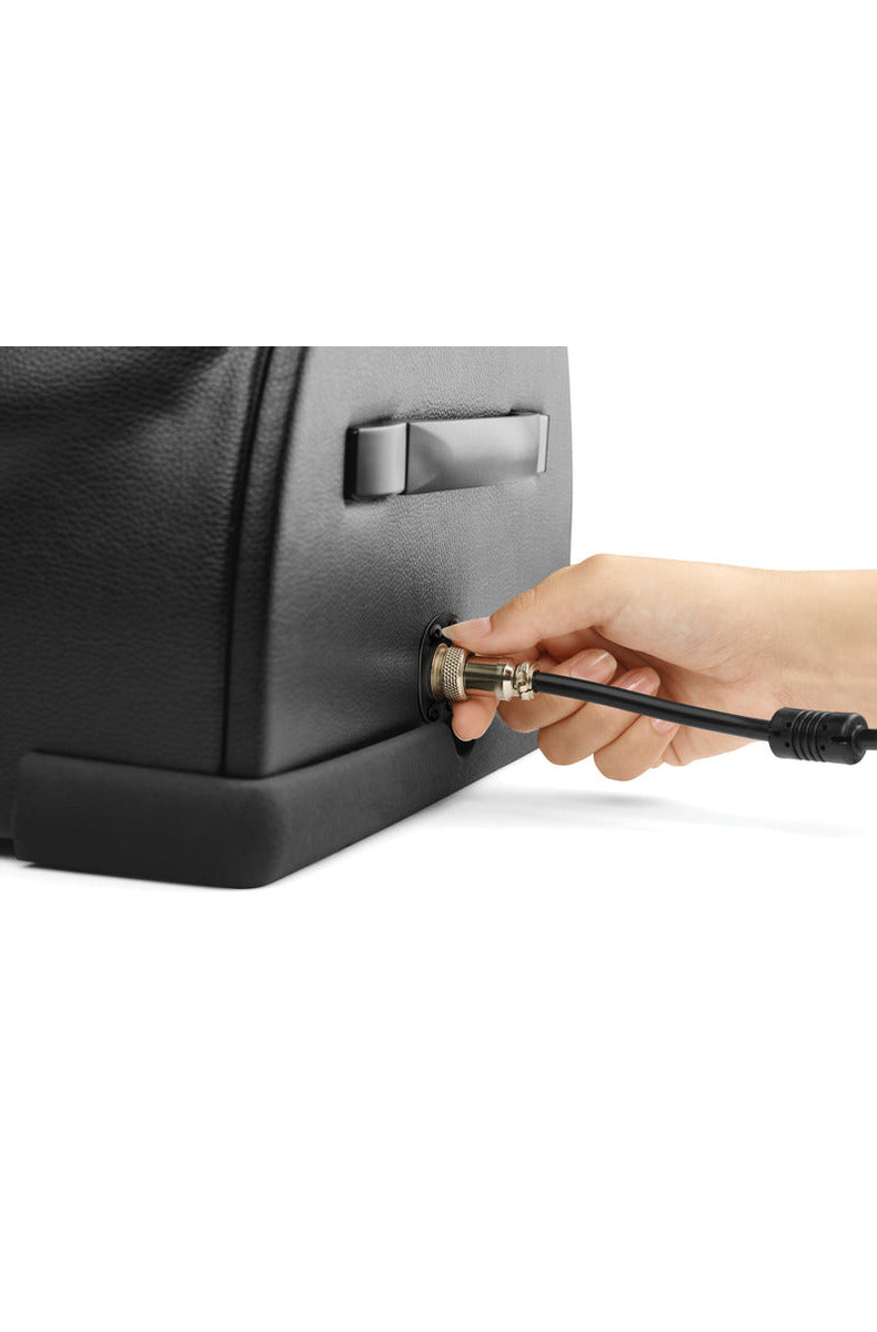 Plugging the power cord into the side of The Cowgirl Premium Riding Sex Machine
