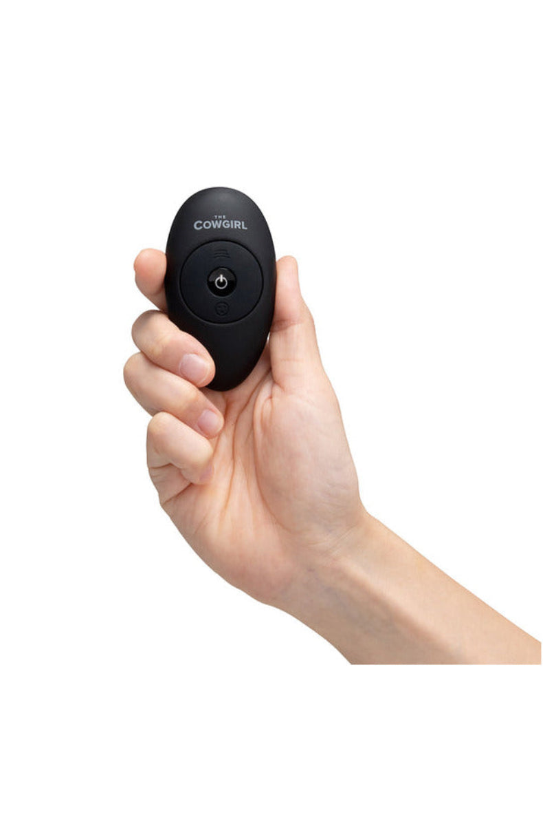 Hand holding The Cowgirl Saddle wireless remote control