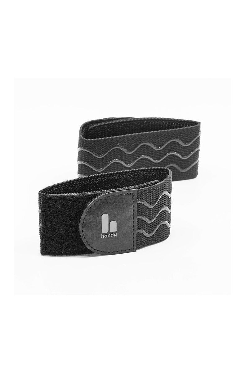 Two Handy TrueGrip Pro Bands in black showing the elastic fabric and anti-slip silicone wave pattern with the handy logo tab
