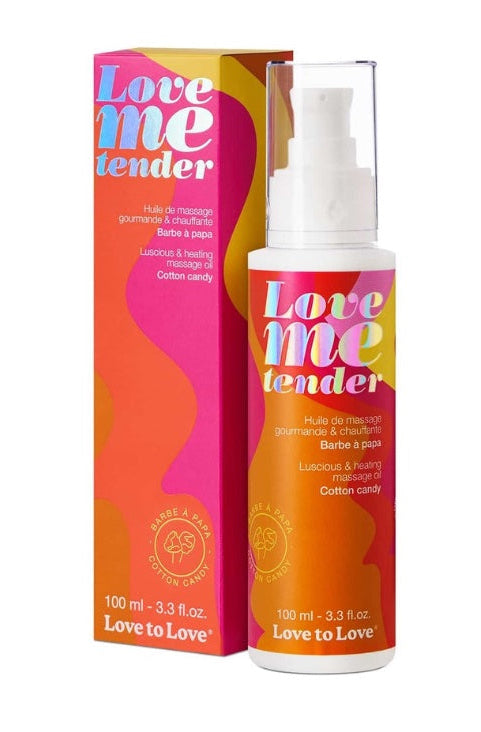 Front view of Love Me Tender massage oil bottle with white pump and orange-pink gradient packaging showing cotton candy flavor