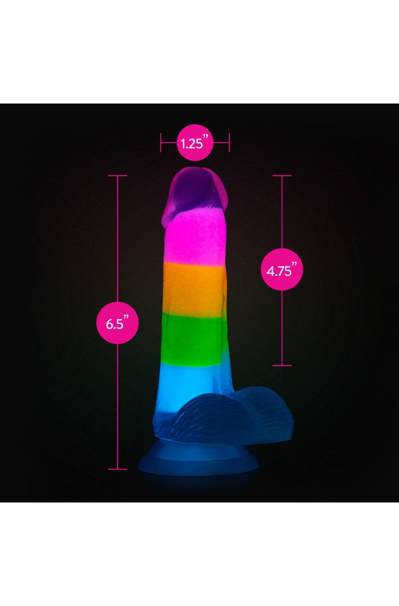 Front view of rainbow striped glow-in-the-dark dildo with realistic head and textured balls base